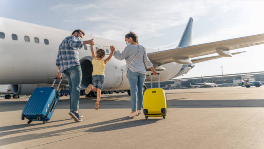 A stress free family walking with luggage to fly away